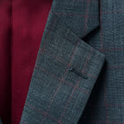 Back view of a men's grey windowpane suit, highlighting its exquisite tailoring and fabric quality.