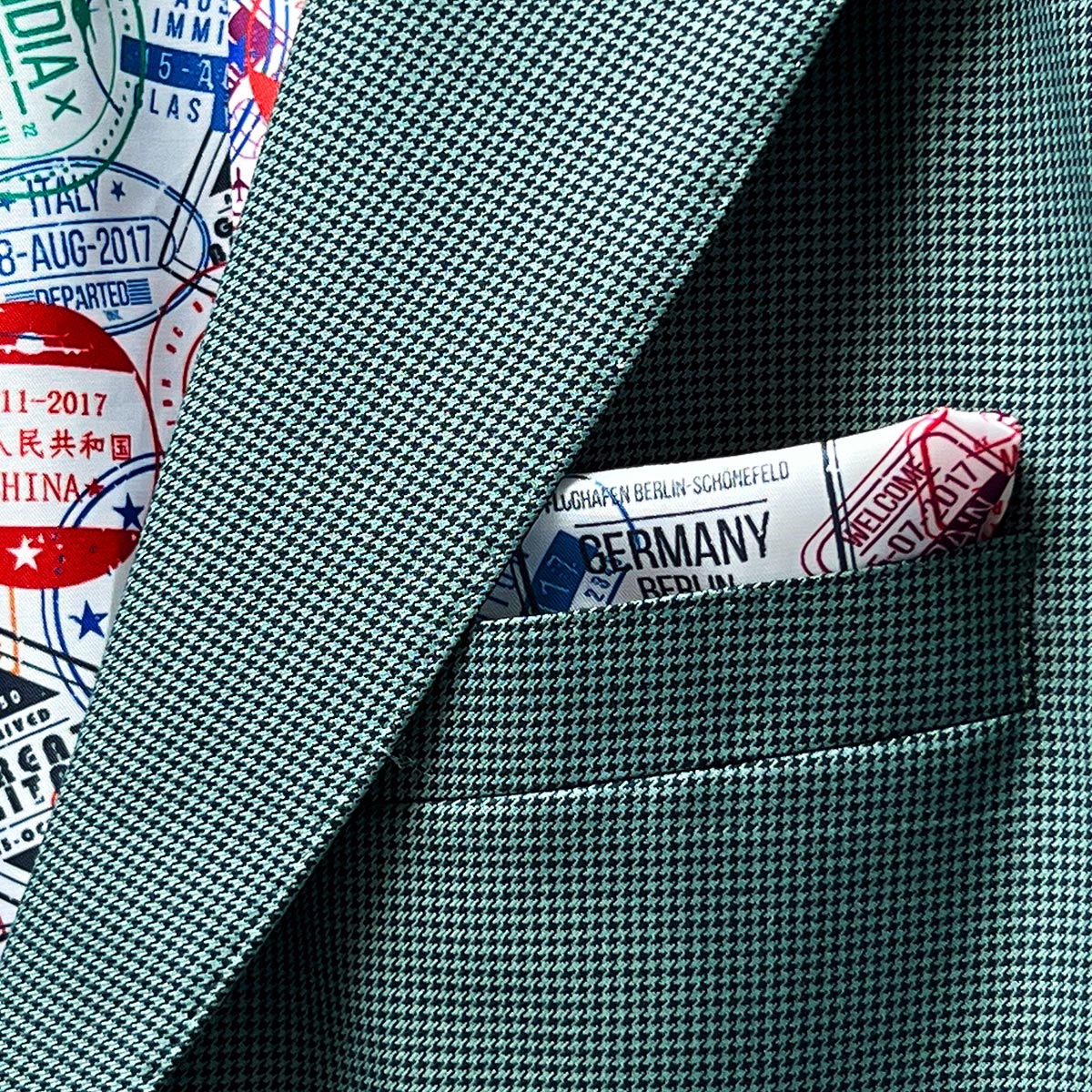 Functional sleeve buttonholes on a hunter green sportcoat.