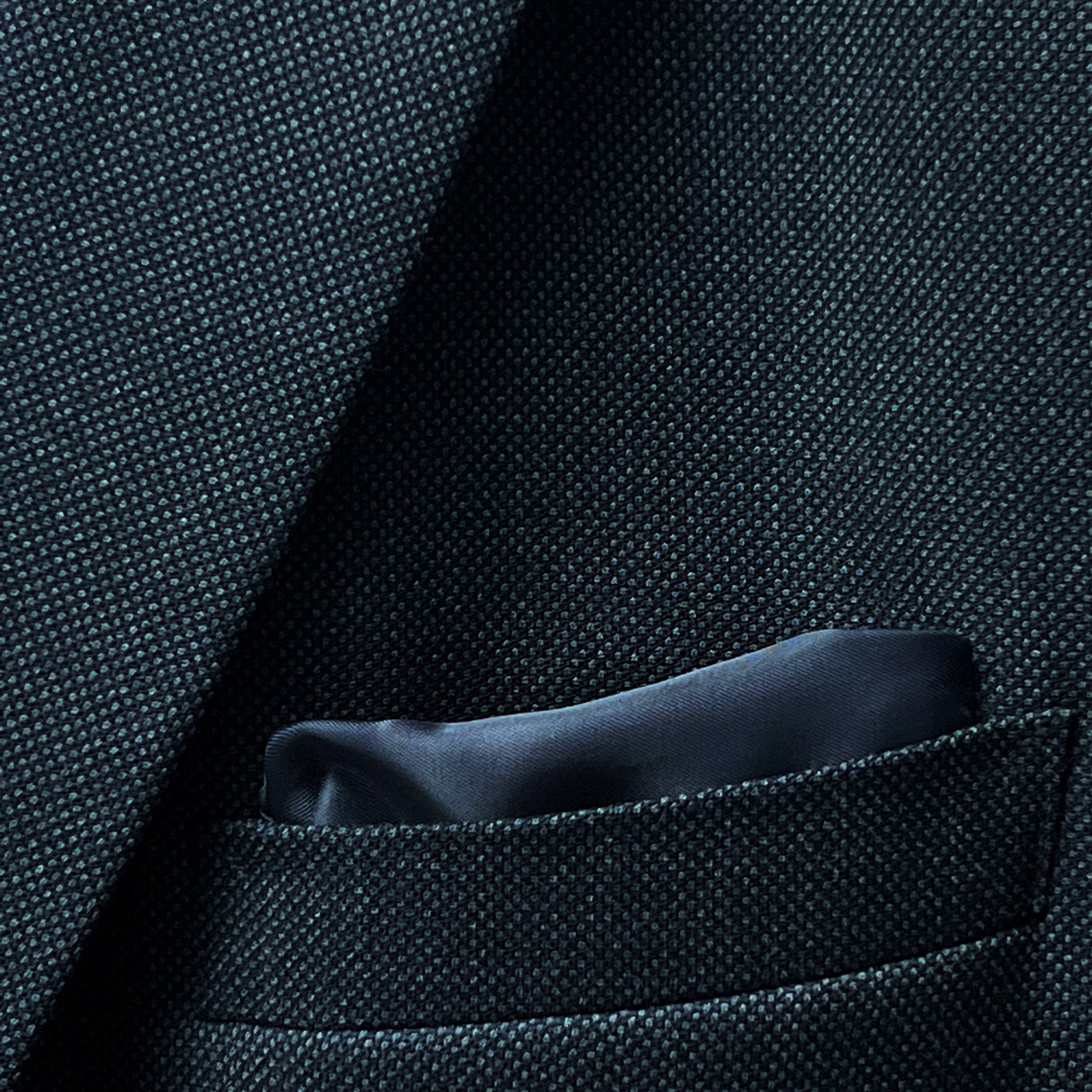 Men's online suit design featuring dark grey birdseye fabric, with a focus on the jacket's inner lining
