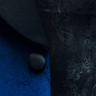 Close-up view of silk satin buttons on a velvet tuxedo dinner suit, exemplifying a rich tradition of tailored elegance for formal evenings.