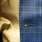 Side view of stone blue trousers, part of a business suit.