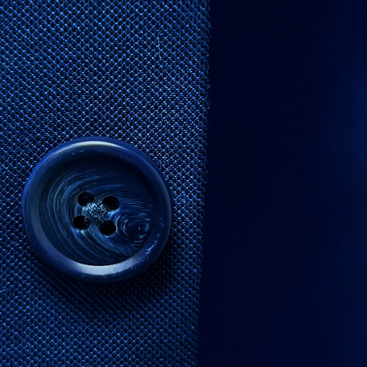 Image featuring the sophisticated blue marble horn buttons on the cobalt blue sharkskin suit.