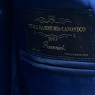 Image featuring the label on the cobalt blue sharkskin suit.