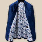 Full interior view of bespoke suit jacket, displaying intricate white, blue, and red floral and paisley lining