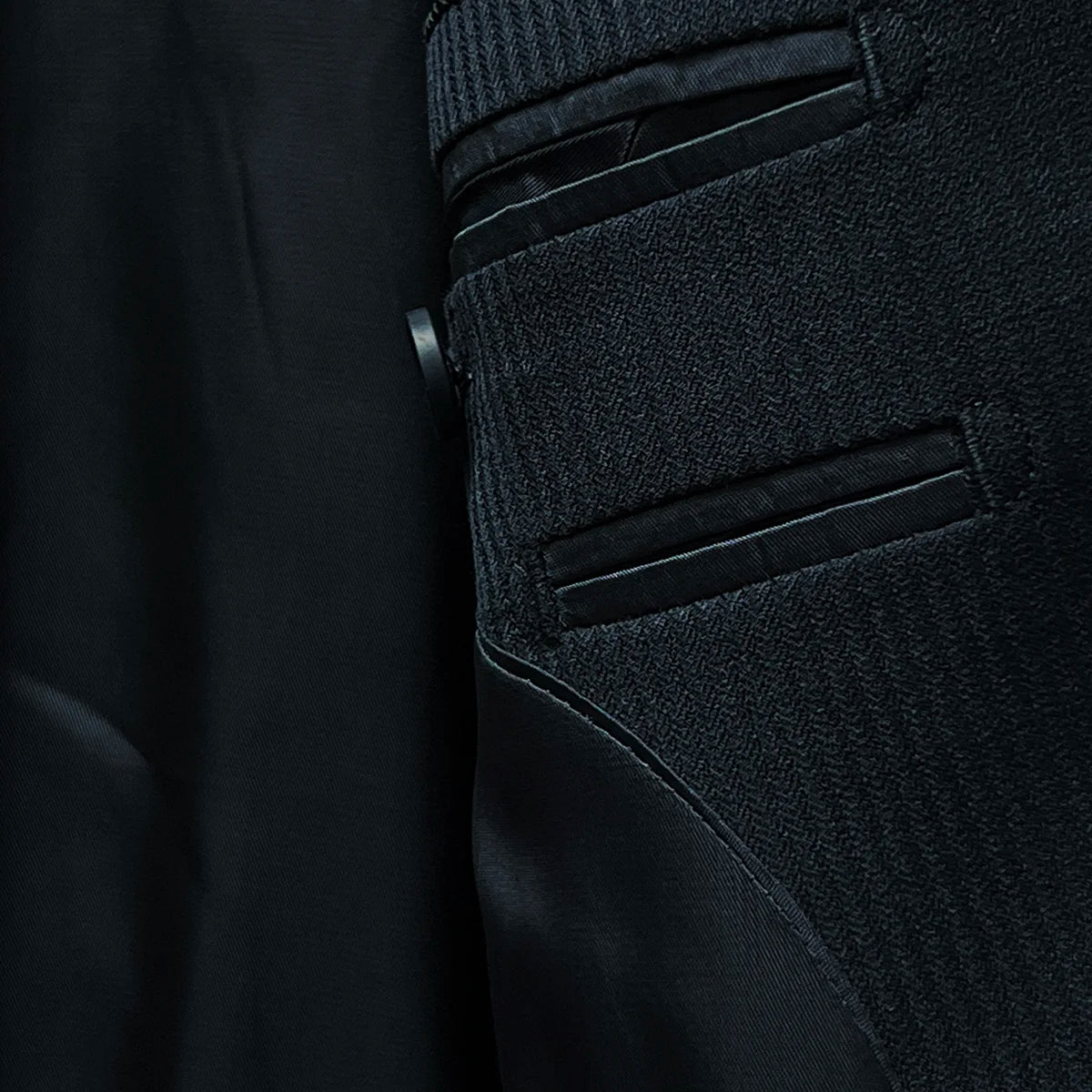 Detailed view of the black Bemberg lining inside the jacket, illustrating its quality and texture.