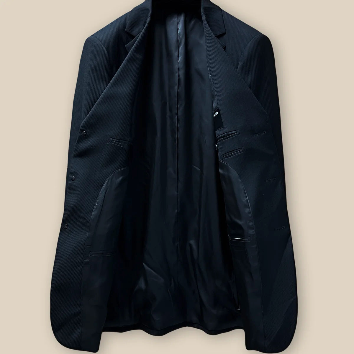 Interior view of the jacket, highlighting the luxurious black Bemberg lining and craftsmanship.