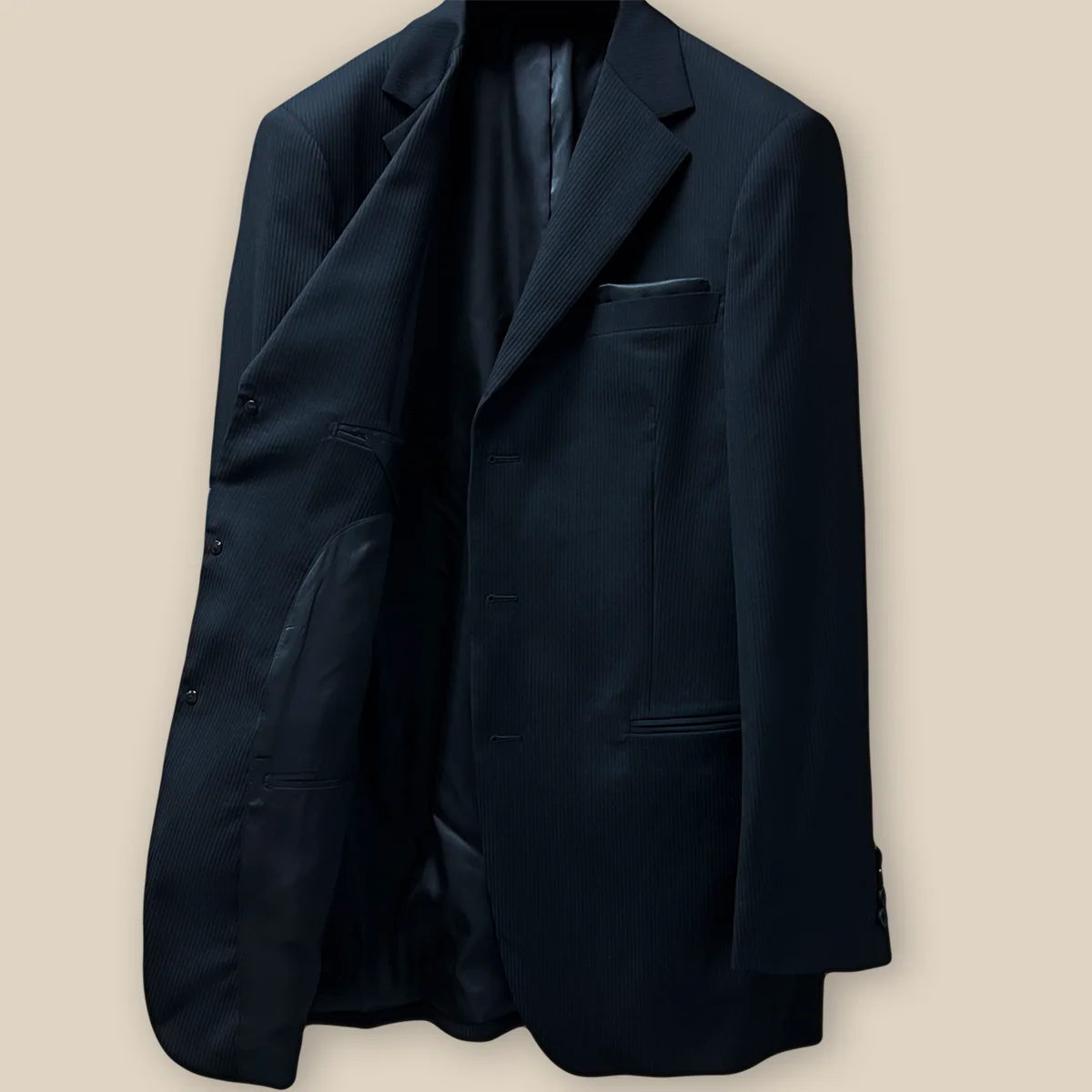 Inside view of the right side of the jacket, showing the black Bemberg lining and pocket details.