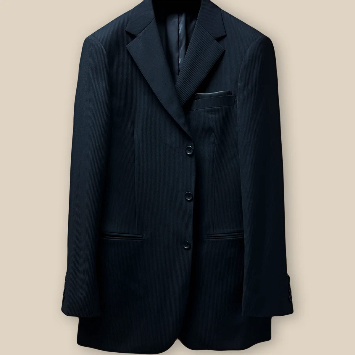 Detailed image of the jacket button panel with black horn buttons and precise buttonholes.