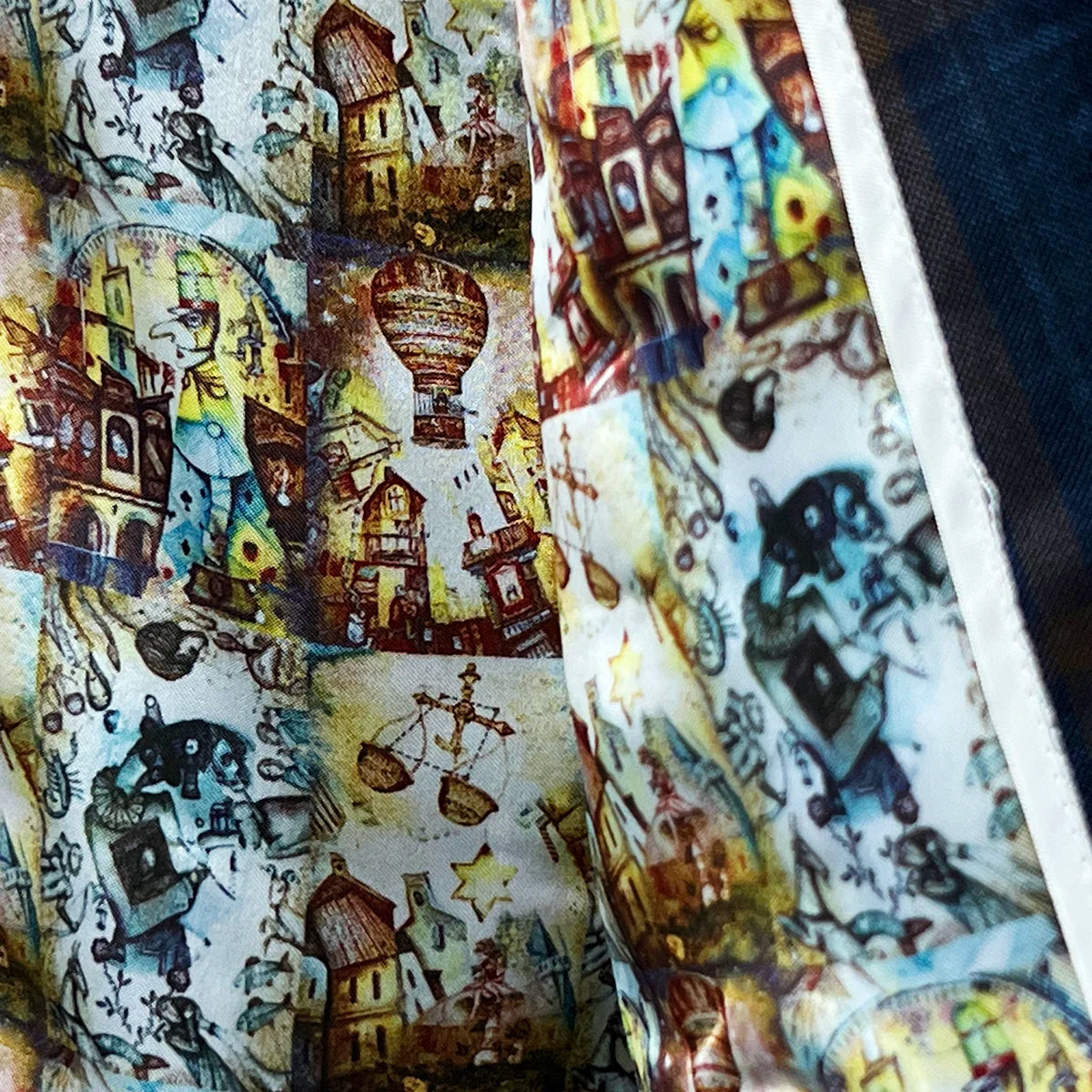 Detailed view of the flash linings, depicting scenes from the Wizard of Oz inside the sportcoat.