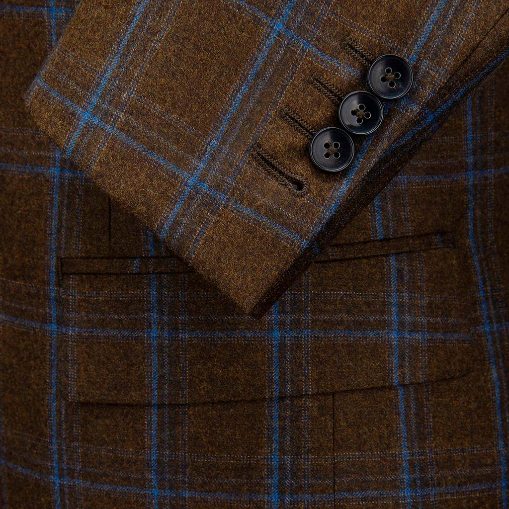 Custom Tailored Brown Plaid Windowpane Suit Sleeve One Button Left Undone Showing Functional Working Buttonholes On A High Quality Custom Tailored Men's Professional Business Suit