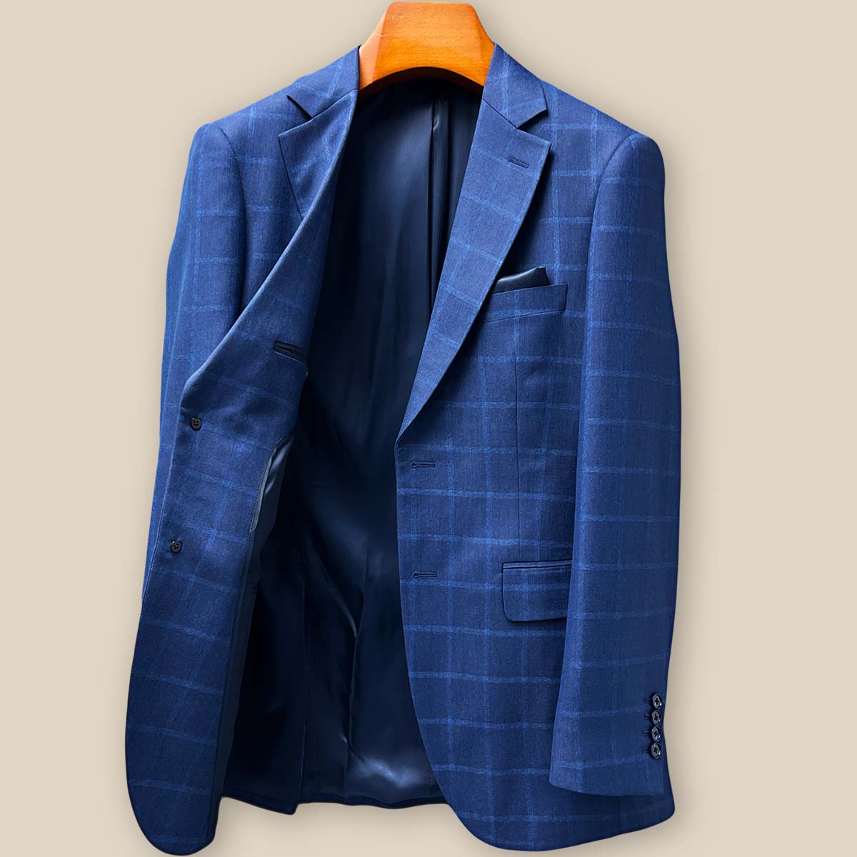 Interior right side construction of the Indigo Blue Windowpane blazer showing internal pockets and fine tailoring details