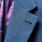 Close-up view of the notch lapel on the suit jacket, showcasing its classic style.