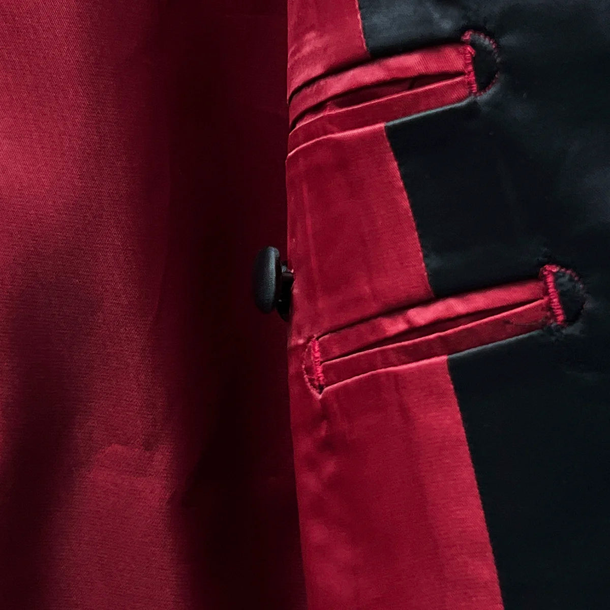 Detailed image of the Bemberg lining, showcasing the rich tomato red color and smooth texture.