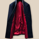 Detailed image of the jacket's interior, featuring the vibrant tomato red Bemberg lining.