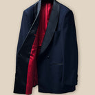 Inside view of the right side of the jacket, showing the sleek tomato red Bemberg lining and inner pocket details.
