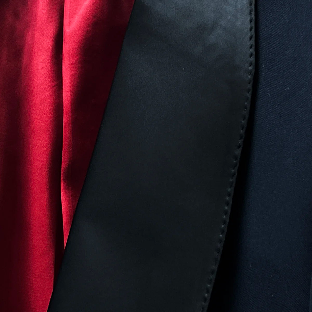 Close-up of the deep shawl lapel with black satin, emphasizing the tuxedo’s luxurious features.