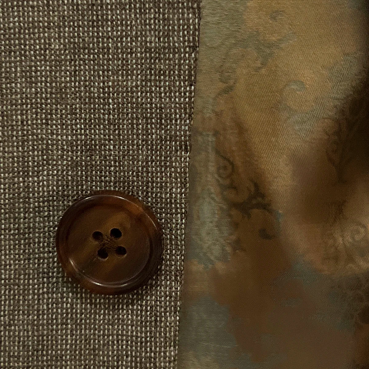 Close-up of the brown horn marble buttons on the Westwood Hart brown nailhead men's suit, highlighting the natural elegance of the buttons.