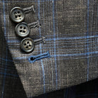 Detailed view of the functional sleeve buttonholes with blue accent stitching.
