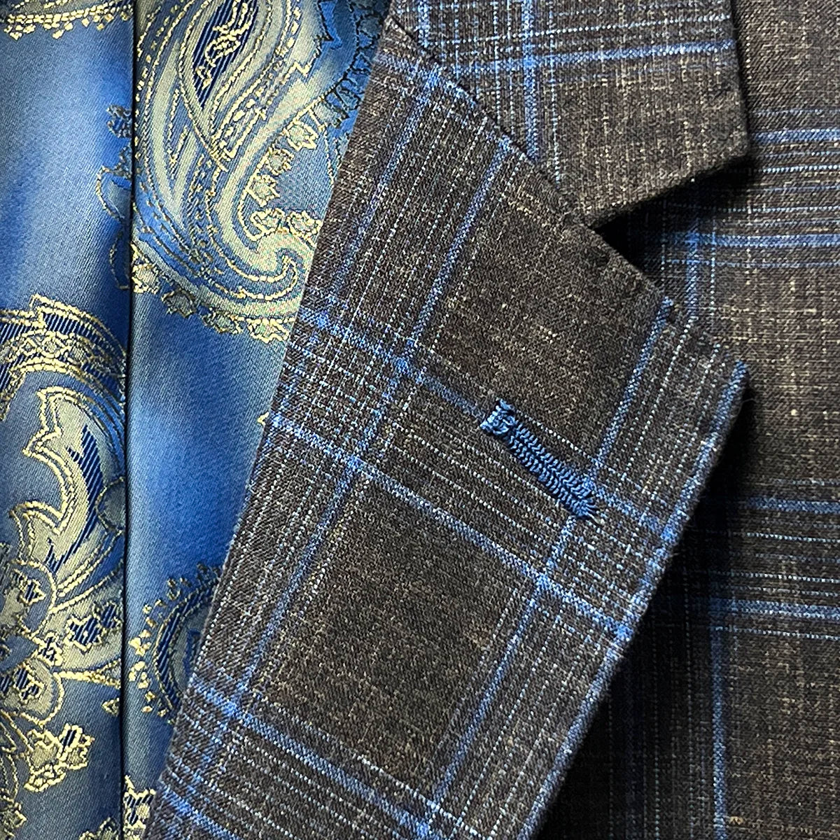 Detailed view of the notch lapel design on the sportcoat.