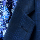 Close-up of the notch lapel on the dark blue windowpane men's sport coat.