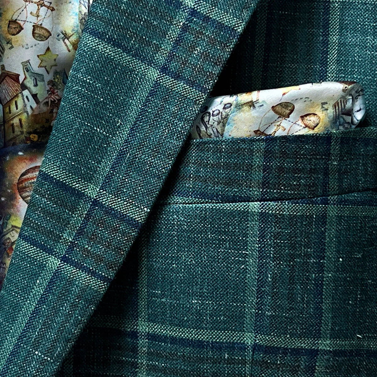 View of the built-in pocket square on the Westwood Hart hunter green with navy and chocolate brown plaid mens sport coat, adding a touch of elegance.