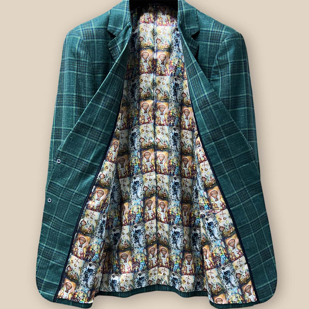 Full view of the whimsical Wizard of Oz flash lining inside the Westwood Hart hunter green with navy and chocolate brown plaid mens sport coat.