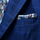 View of the built-in pocket square in the royal blue suit with navy and white windowpane design.