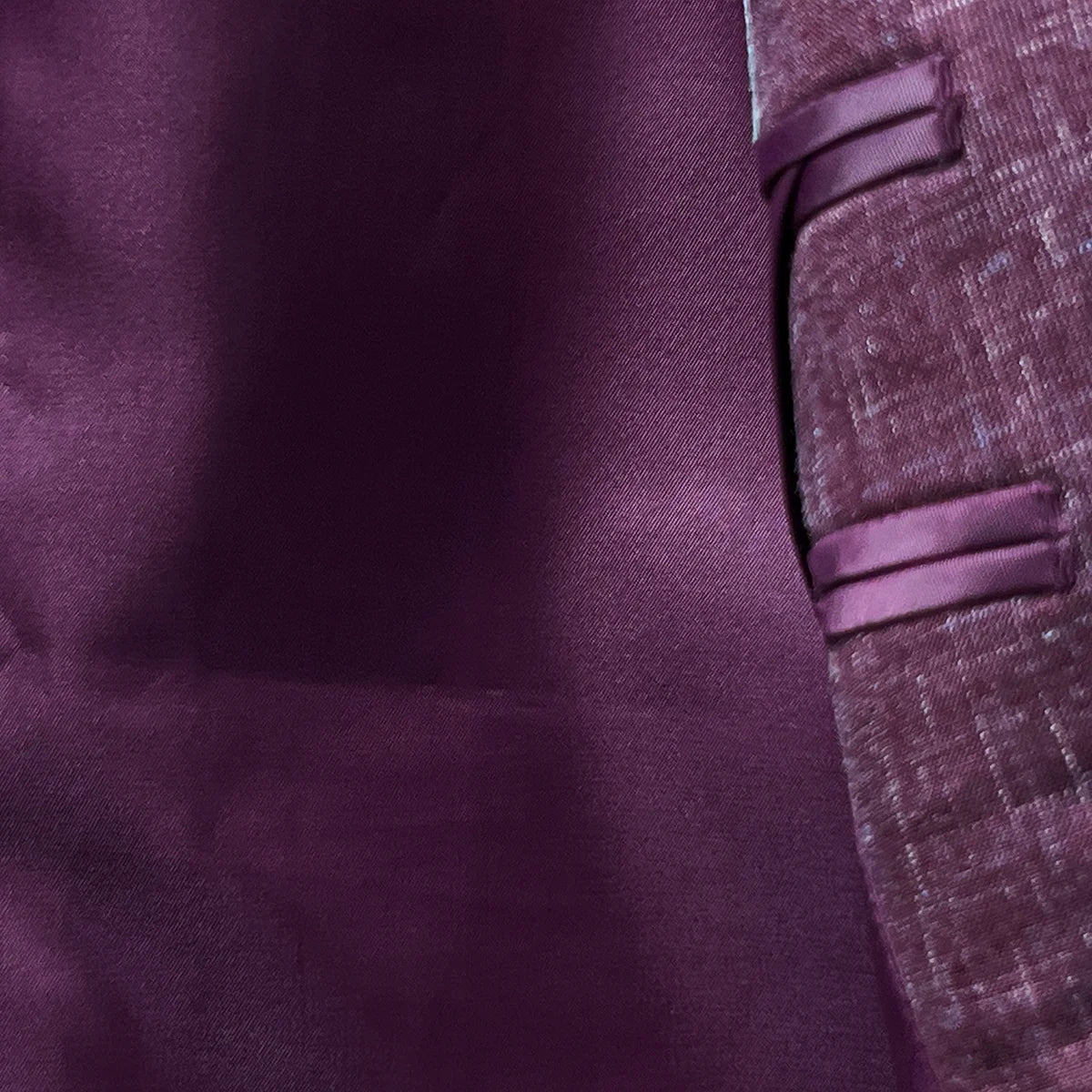 Maroon bemberg silk lining inside a cranberry men's suit by Westwood Hart, ensuring comfort and luxury.