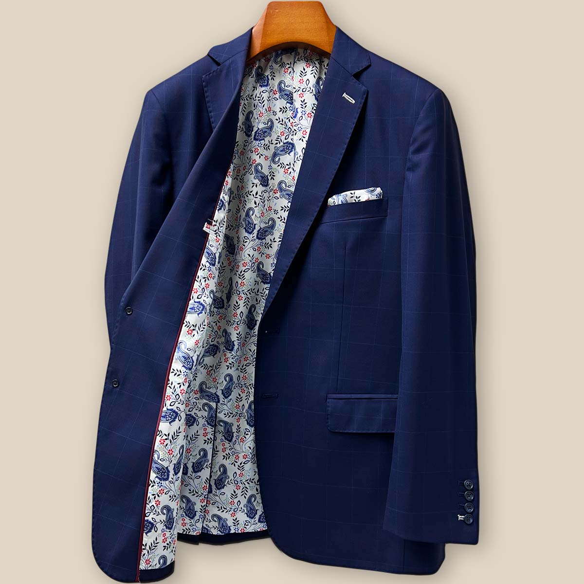 Interior right side view of the navy suit jacket, displaying tailoring details, stitching quality, and lining attachment