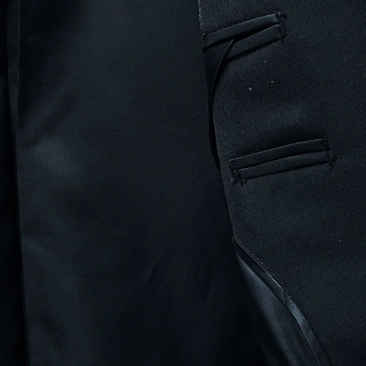 Bemberg lining providing a smooth and comfortable fit in a classic black men's suit.