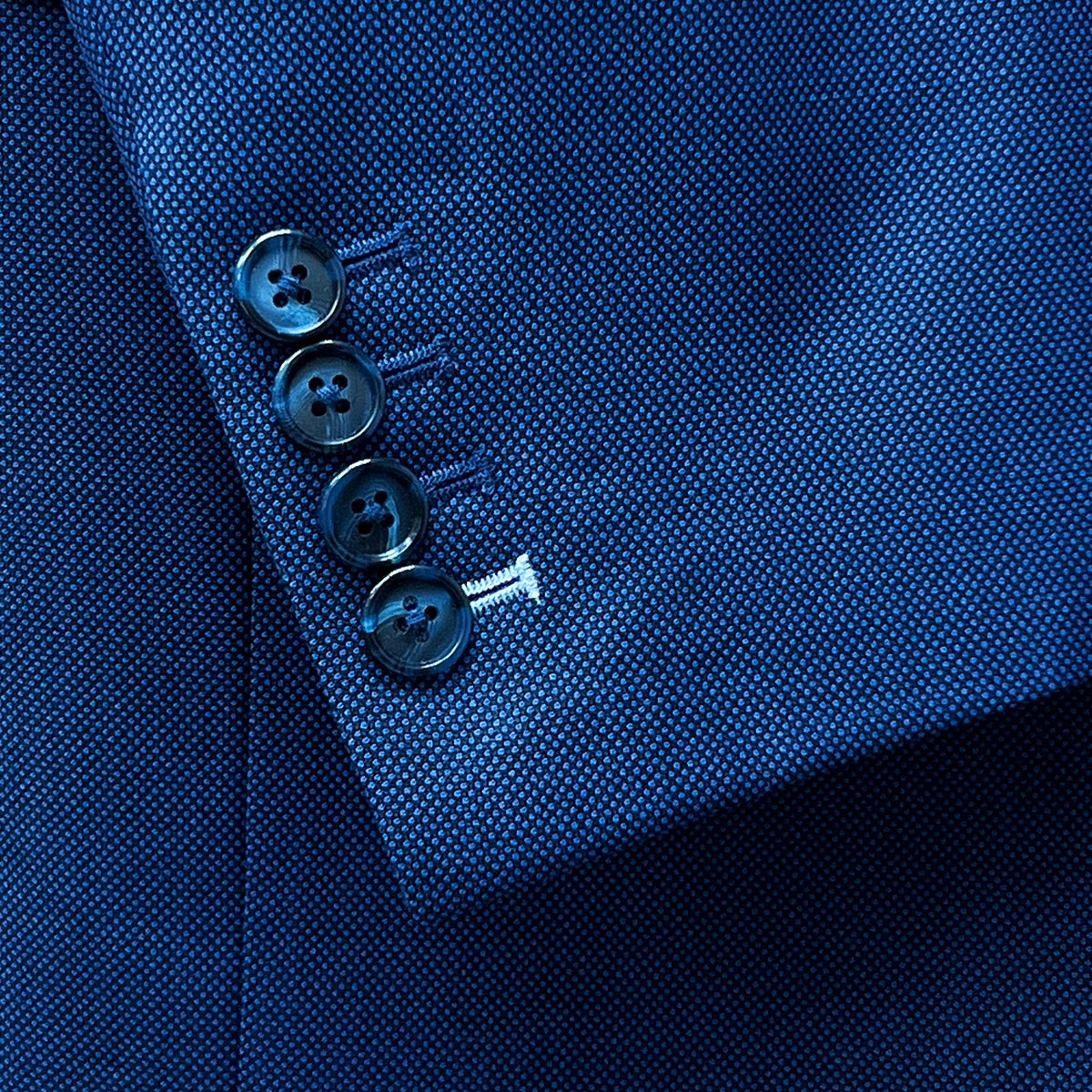 blue birdseye sleeve buttonholes