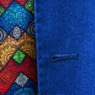 Detailed view of a buttonhole on a light blue flannel suit.