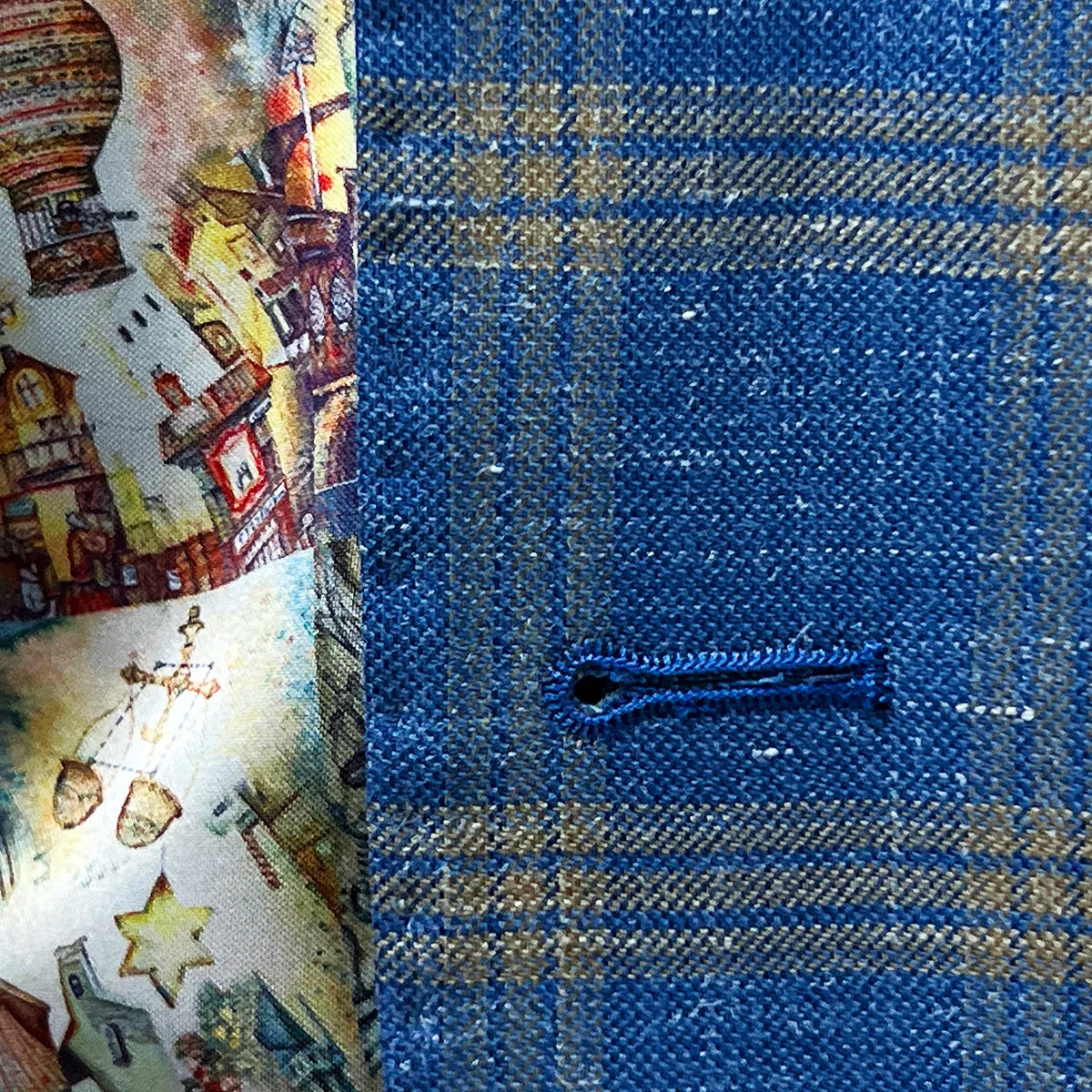 Jacket buttonhole panel view showcasing the button arrangements on a sky blue with tan windowpane men's sport coat.