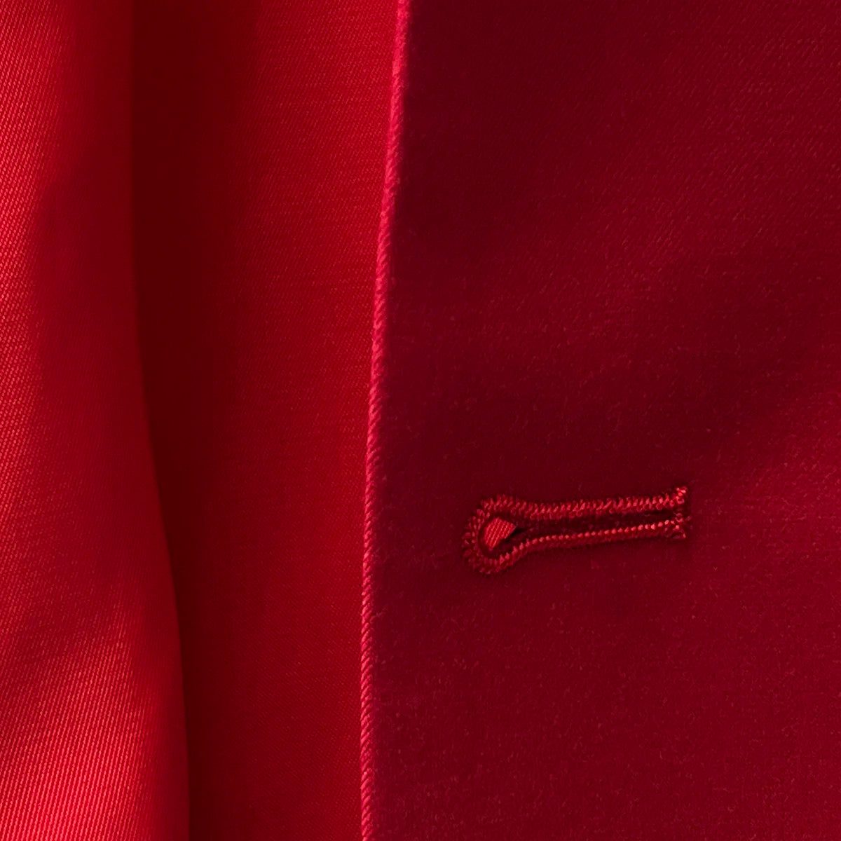Bemberg lining ensuring a smooth, comfortable fit on a scarlet red, solid plain color suit.