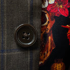 Close-up of brown horn buttons on a chocolate brown sportcoat.