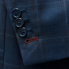 Close-up view of the sportcoat's contrast accent buttonholes with maroon stitching.