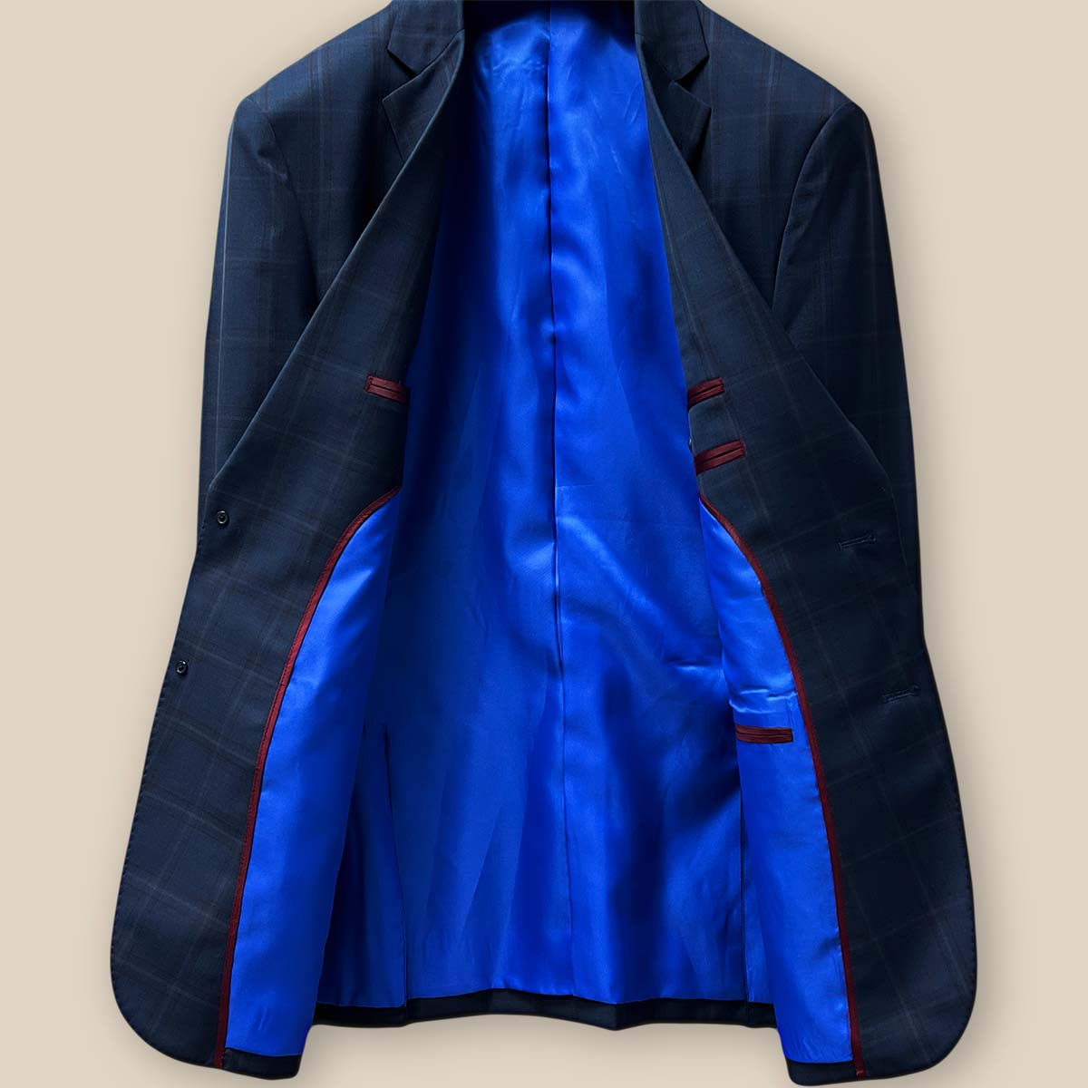 Full view of the sportcoat's interior highlighting the royal blue lining and maroon piping details.