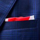 Creative styling option showing the built-in pocket square customization for the blue windowpane Zegna sportcoat with complementary royal blue accent