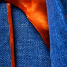 Bemberg lining of the sportcoat, showcasing the high-quality, breathable material and the vibrant orange color.