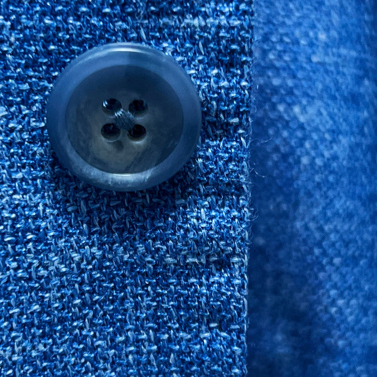Blue horn marble buttons on the sportcoat, presenting the fine details and exquisite materials used.