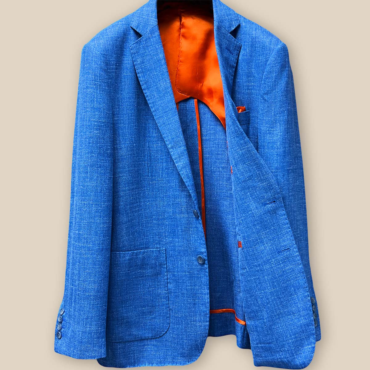 Inside view of the sportcoat's left side, featuring the vibrant bemberg orange lining and the detailed stitching craftsmanship.