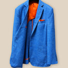 Inside right view of the sportcoat, showcasing the open patch pockets and the smooth bemberg orange lining.