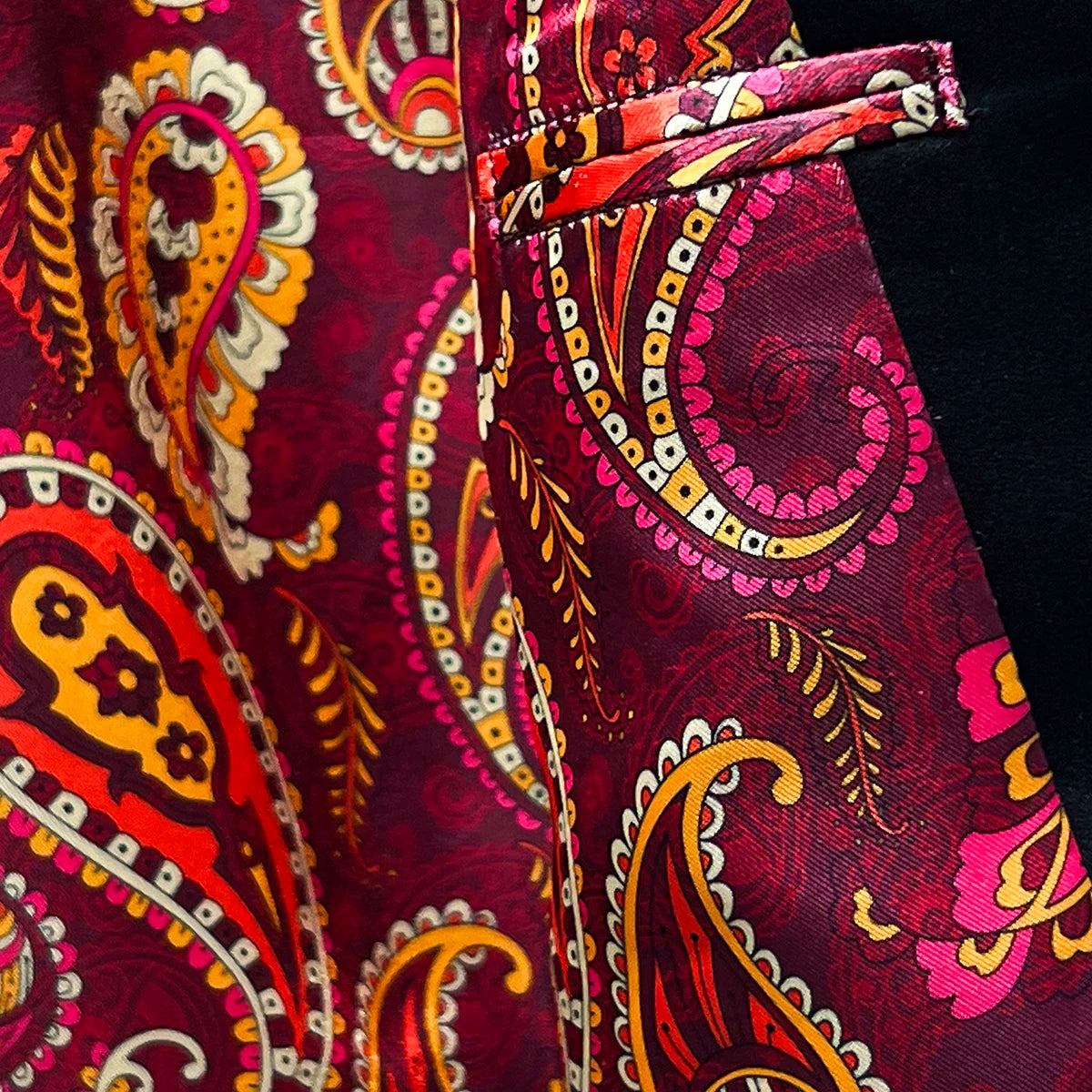 Inside view of flash linings in a burgundy velvet tuxedo jacket.