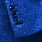 Functional sleeve buttonholes on a light blue flannel suit.