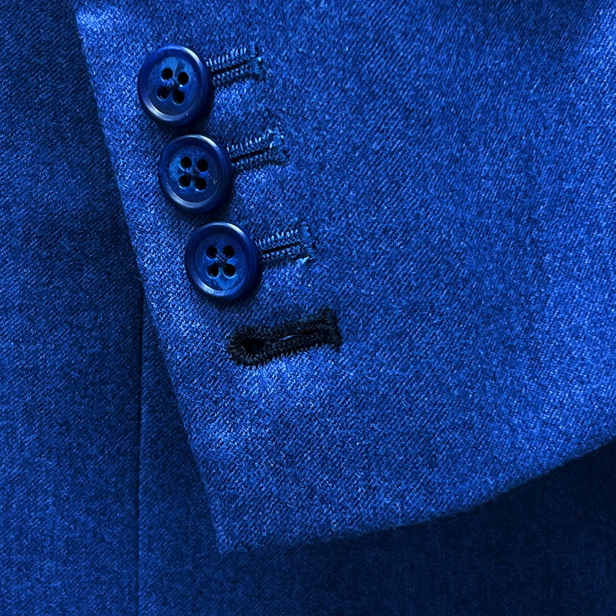 Functional sleeve buttonholes on a light blue flannel sportcoat.
