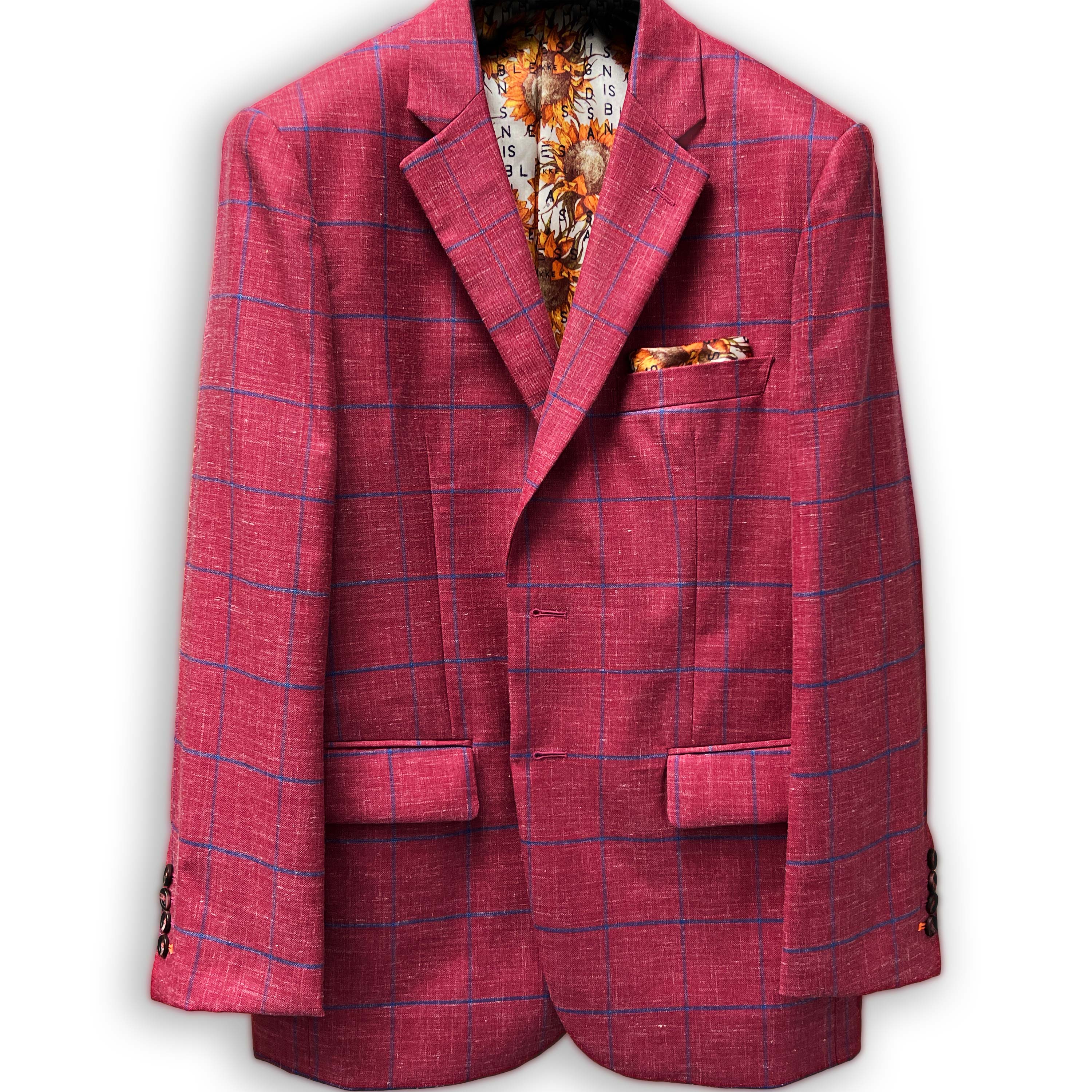Modern suit style showcasing rust maroon sportcoat with royal blue windowpane.
