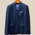 Detailed view of jacket front closure, showcasing navy horn buttons against birdseye pattern