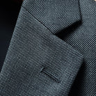 Close-up view of notch lapel showing the fine Super 150's wool texture and tailoring details