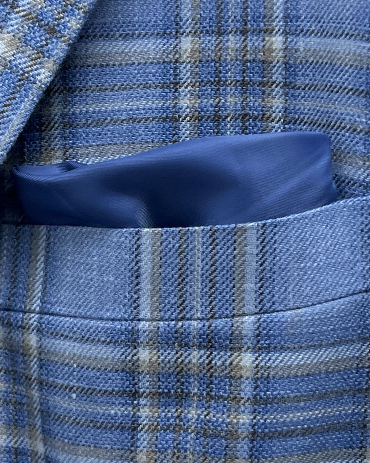 Breast pocket detail of Powder Blue with Tan Windowpane Plaid men's sport coat showing the built in lining pocket square