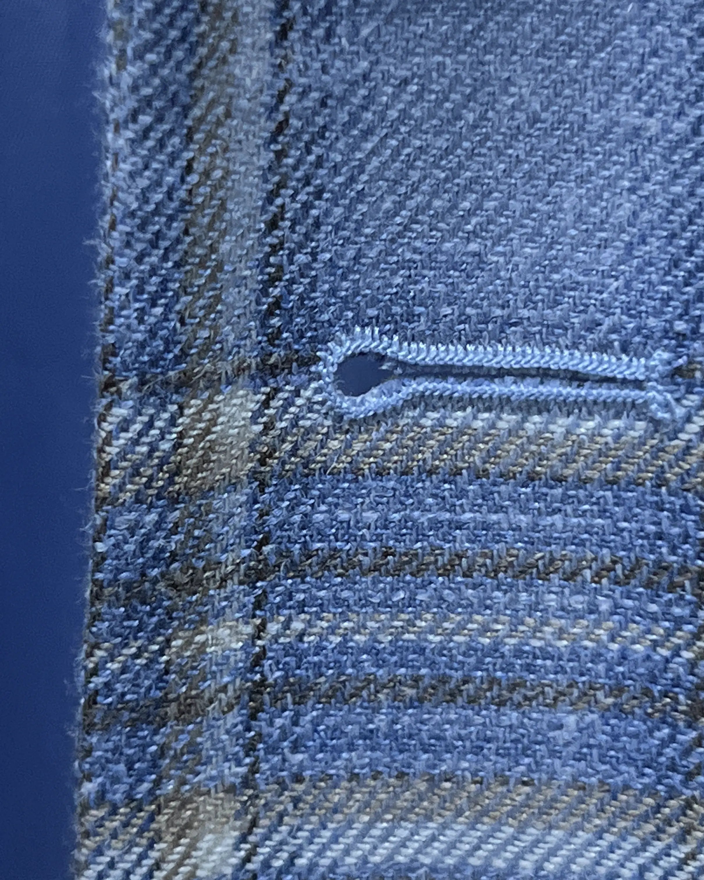 Buttonhole detail of Powder Blue with Tan Windowpane Plaid men's sport coat showing the front buttonhole finish